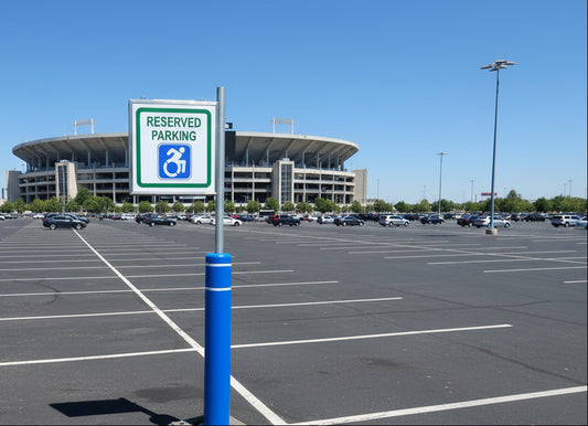 Reserved parking sign for disabled individuals on a metal pole with a blue background.